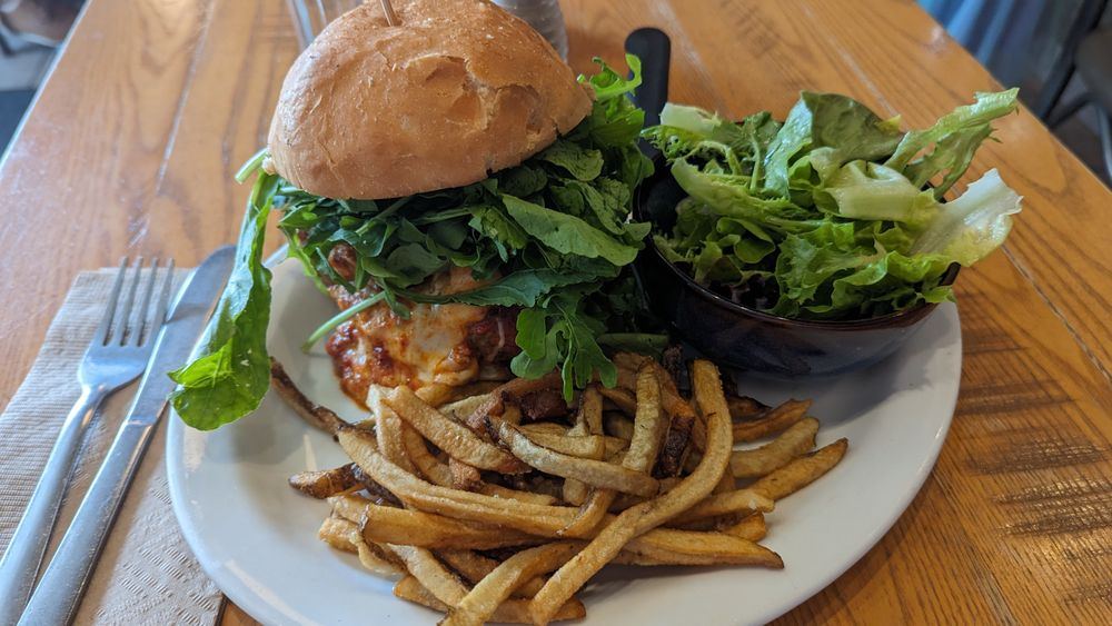 Burger with greens, hand-cut fries and a side salad