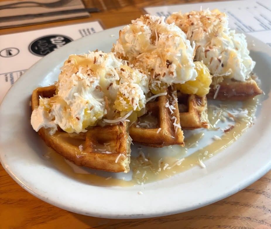 Pina colada waffle special with crushed pineapple, toasted coconut and coconut whipped cream